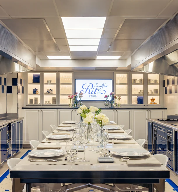 Réjane kitchen at the Ecole Ritz Escoffier, with a set table