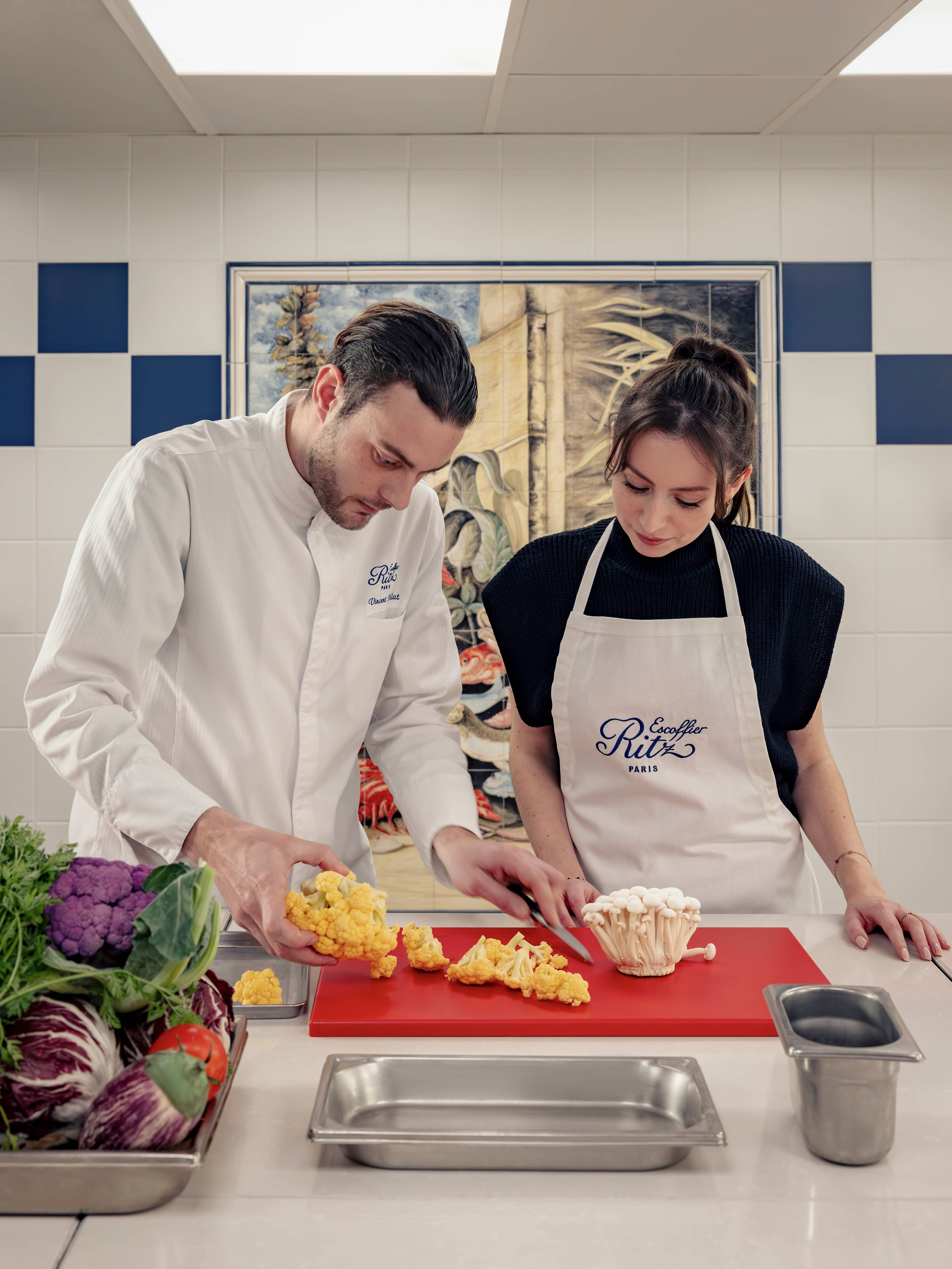 Slicing fresh vegetables during a cooking class at the Ecole Ritz Escoffier