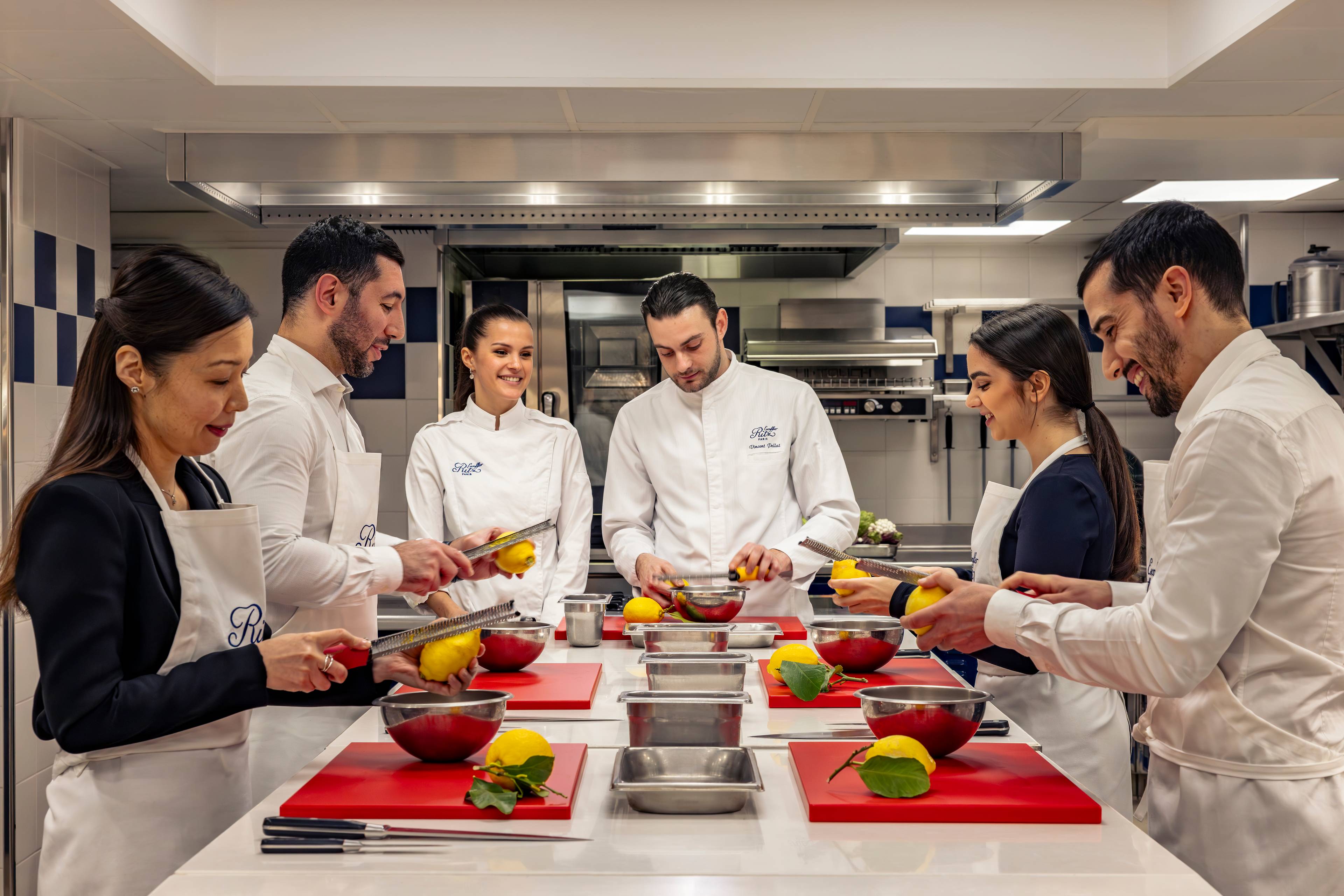 Zesting a lemon during a cooking class at the Ecole Ritz Escoffier