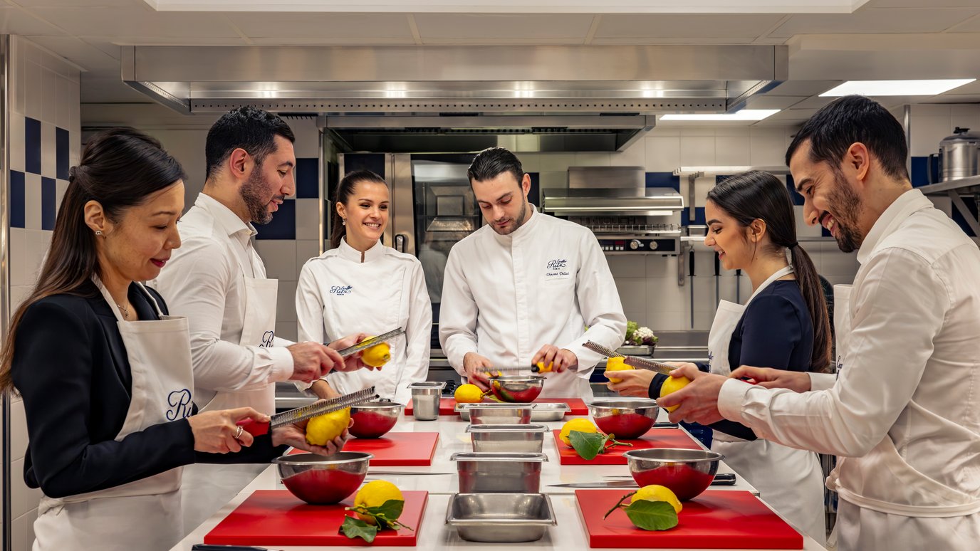 Zesting a lemon during a cooking class at the Ecole Ritz Escoffier
