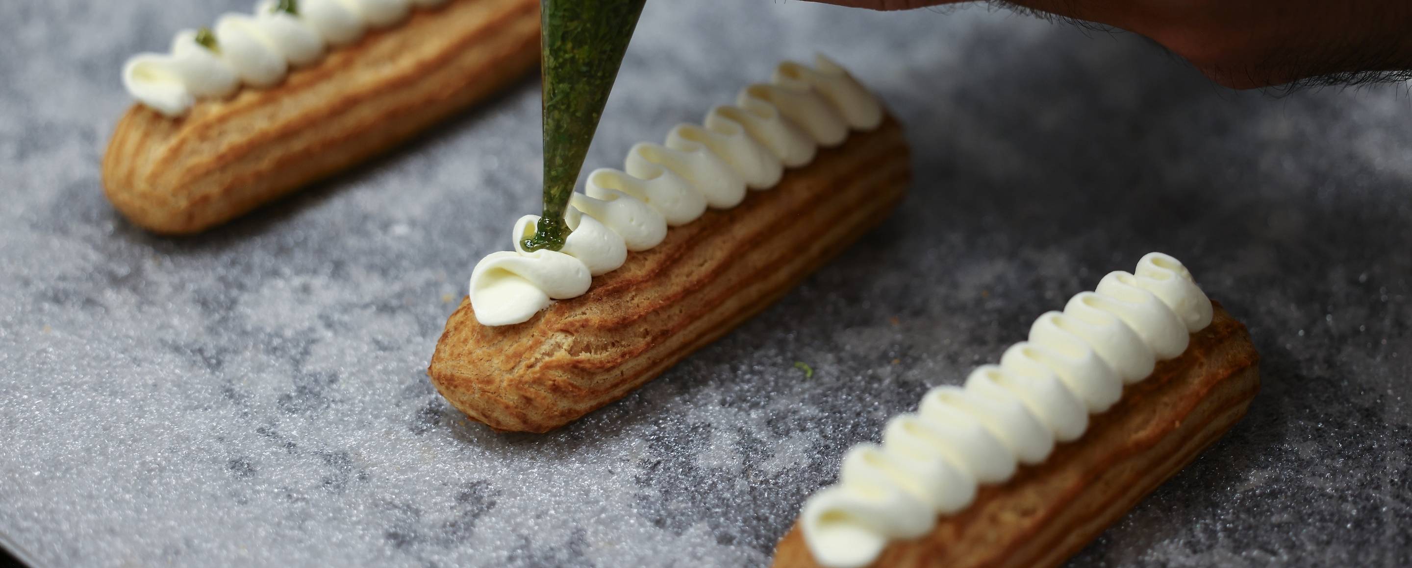 Eclair plating during a pastry class