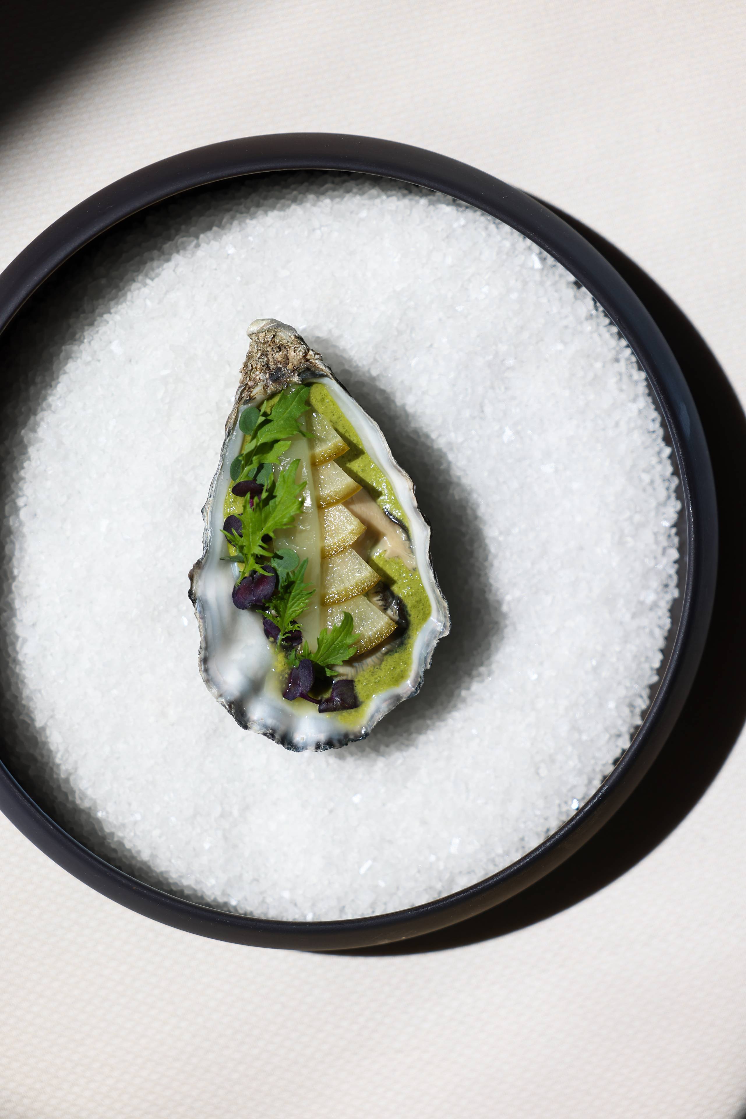 Refined dish served in an oyster shell